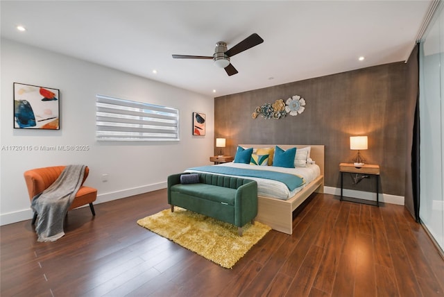 bedroom featuring ceiling fan and dark wood-type flooring