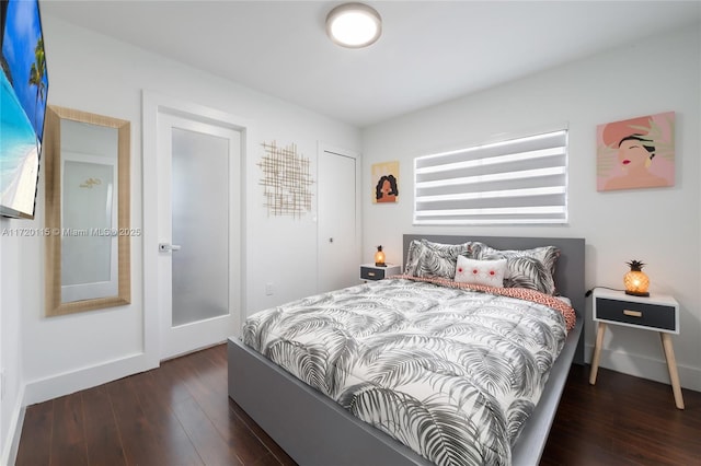 bedroom featuring dark hardwood / wood-style floors