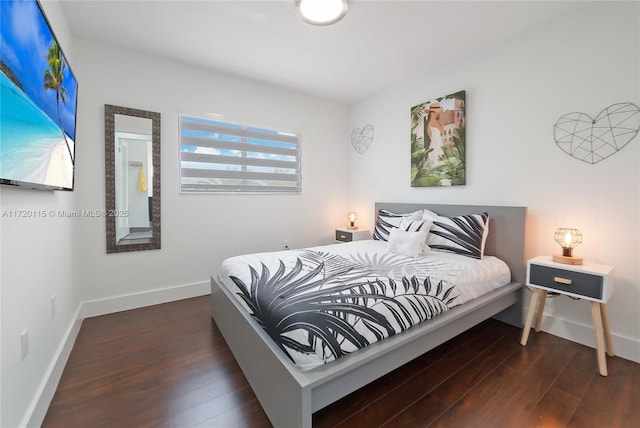 bedroom with dark hardwood / wood-style flooring