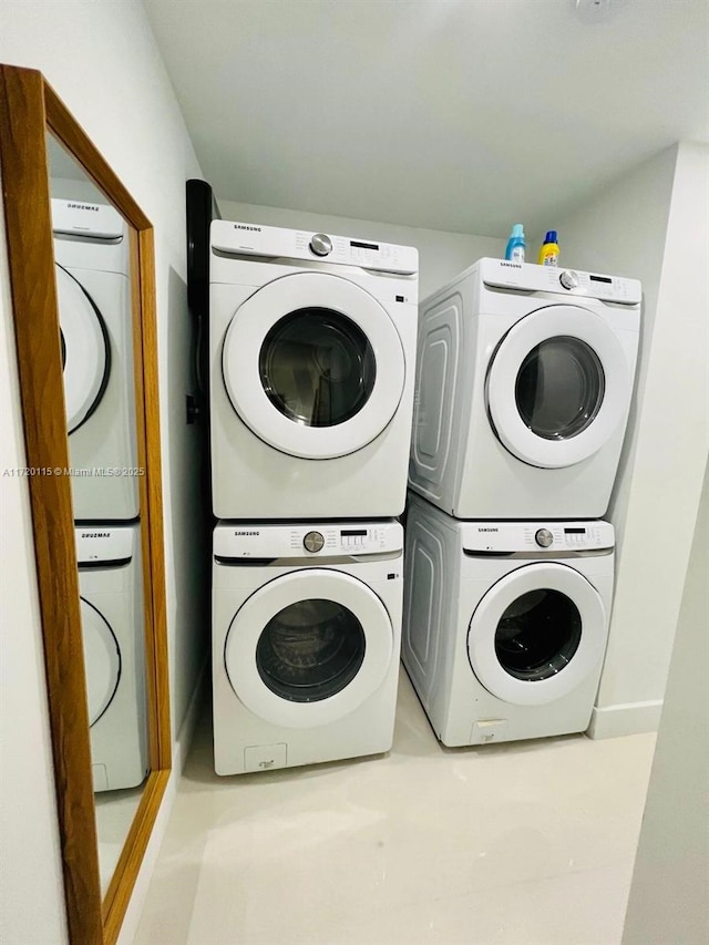 laundry area featuring stacked washing maching and dryer