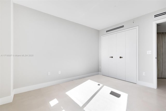 unfurnished bedroom with a closet