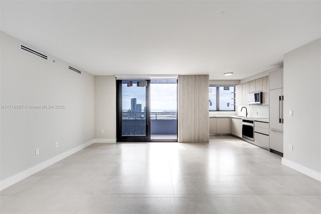 kitchen with stainless steel oven and sink