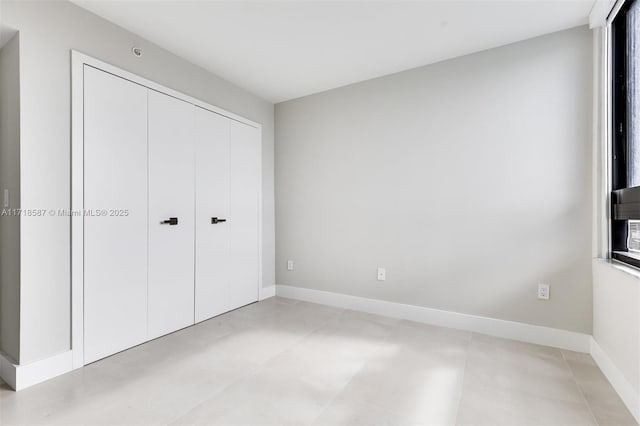 unfurnished bedroom with a closet