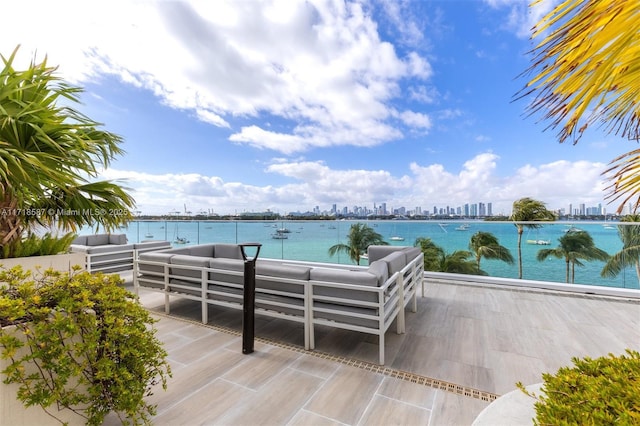 exterior space featuring an outdoor living space and a water view