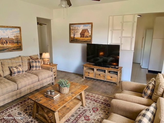 living room with ceiling fan and hardwood / wood-style floors