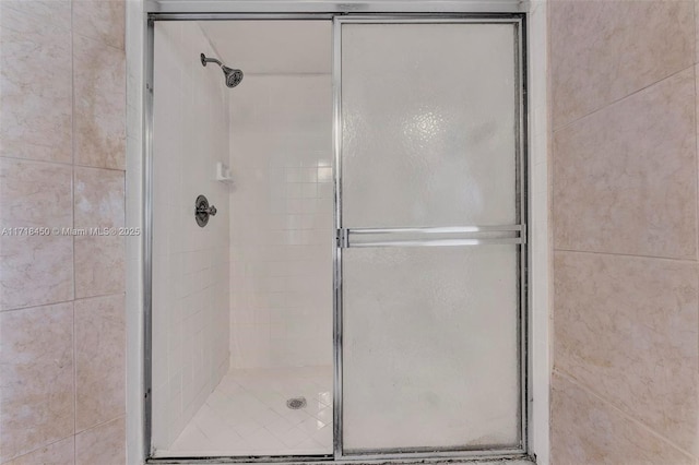 bathroom featuring an enclosed shower