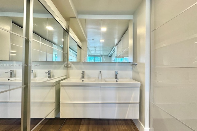 bathroom featuring hardwood / wood-style floors and vanity