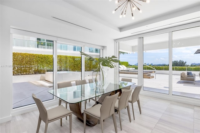 sunroom with a chandelier