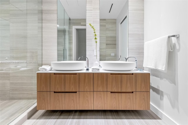 bathroom featuring vanity and walk in shower