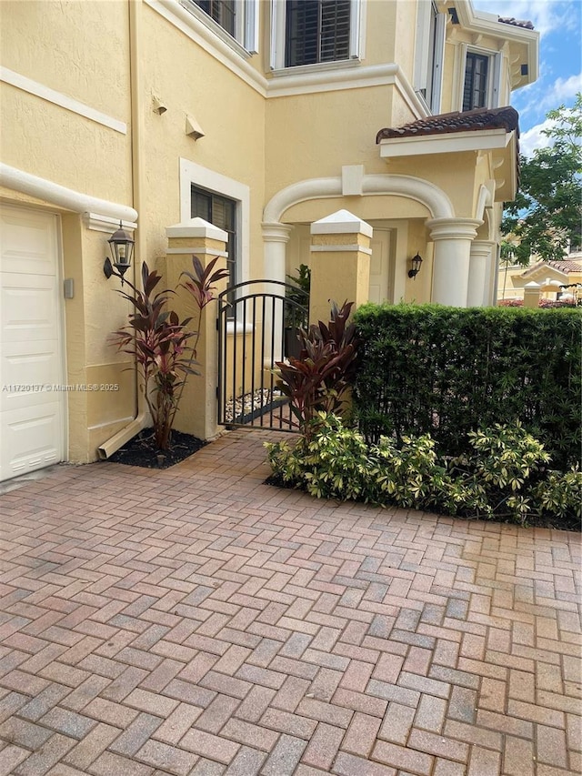 entrance to property featuring a garage