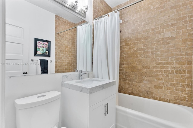 full bathroom featuring vanity, toilet, and shower / bathtub combination with curtain