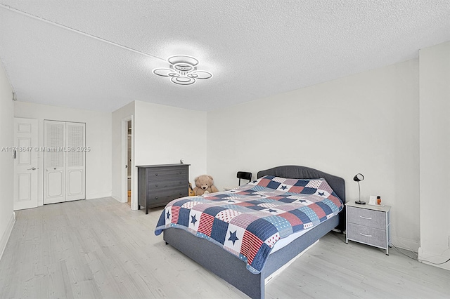 800 Parkview Dr Unit 1001, Hallandale Beach, FL 33009 - bedroom with light wood-style floors and a textured ceiling