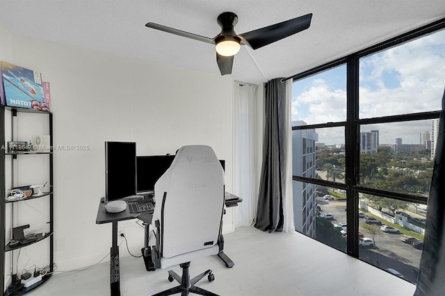 800 Parkview Dr Unit 1001, Hallandale Beach, FL 33009 - office space with a ceiling fan, a wall of windows, healthy amount of natural light, and a textured ceiling
