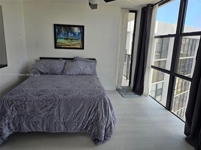 800 Parkview Dr Unit 1001, Hallandale Beach, FL 33009 - bedroom with wood finished floors, floor to ceiling windows, and access to outside