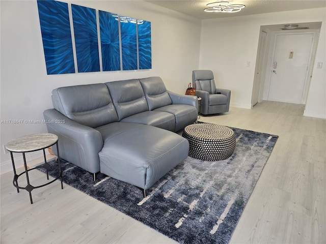 800 Parkview Dr Unit 1001, Hallandale Beach, FL 33009 - living area featuring wood finished floors and baseboards