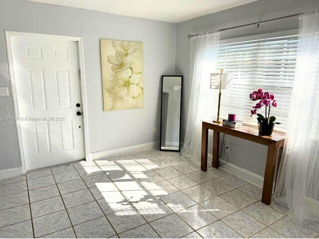 kitchen featuring kitchen peninsula, backsplash, white cabinets, appliances with stainless steel finishes, and sink