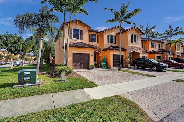 mediterranean / spanish-style home with a garage