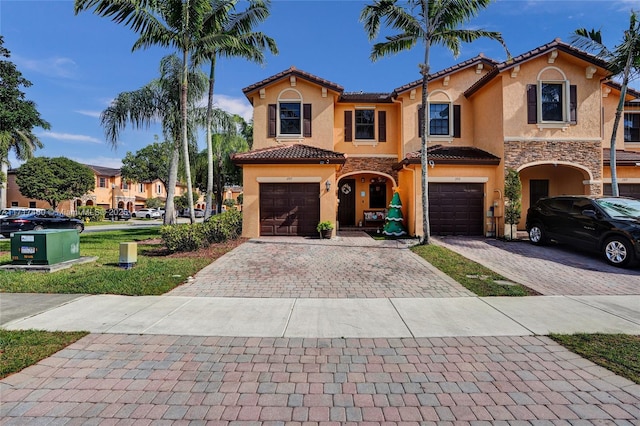 mediterranean / spanish-style home featuring a garage