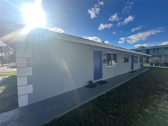 view of home's exterior with a yard