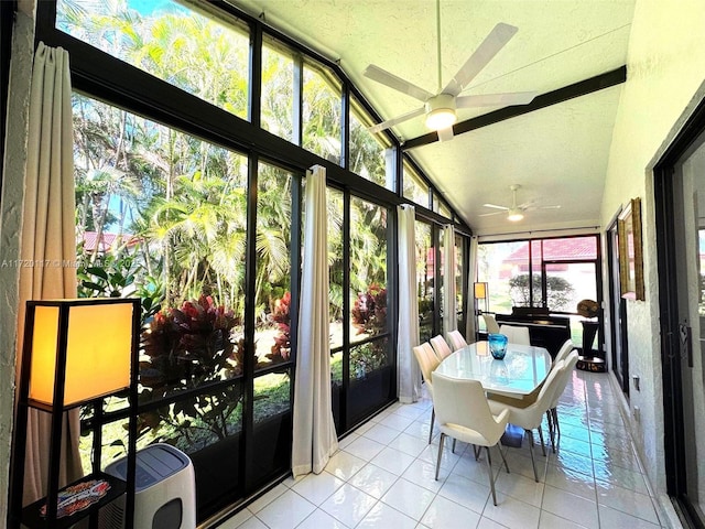 sunroom featuring ceiling fan and vaulted ceiling