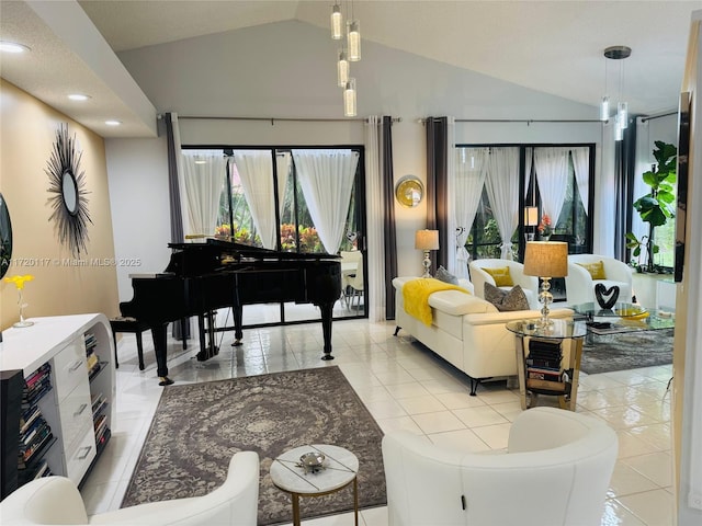 sitting room featuring vaulted ceiling and light tile patterned floors