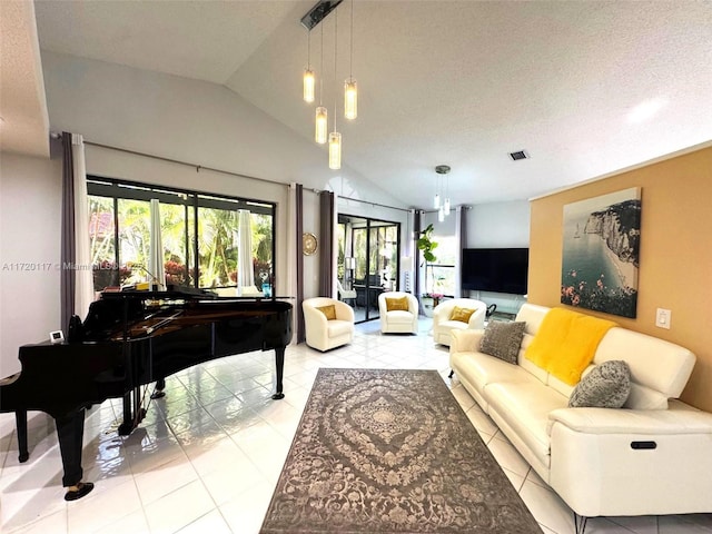 living area with light tile patterned flooring, vaulted ceiling, and a textured ceiling