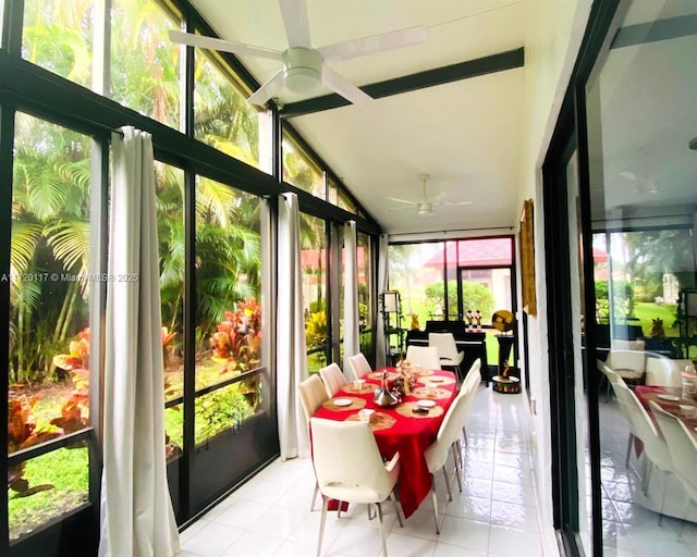 sunroom featuring ceiling fan, plenty of natural light, and lofted ceiling