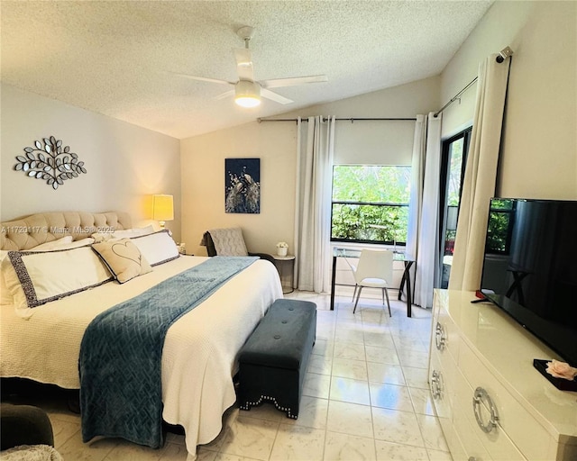 bedroom featuring vaulted ceiling, ceiling fan, and a textured ceiling