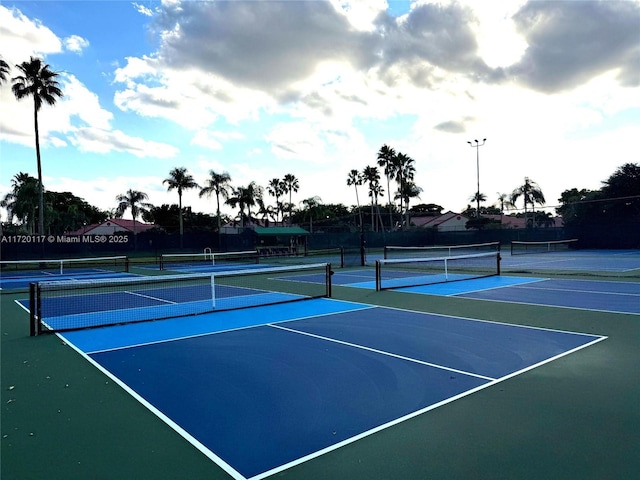 view of tennis court with fence