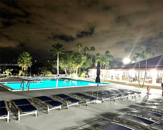 view of swimming pool with a patio