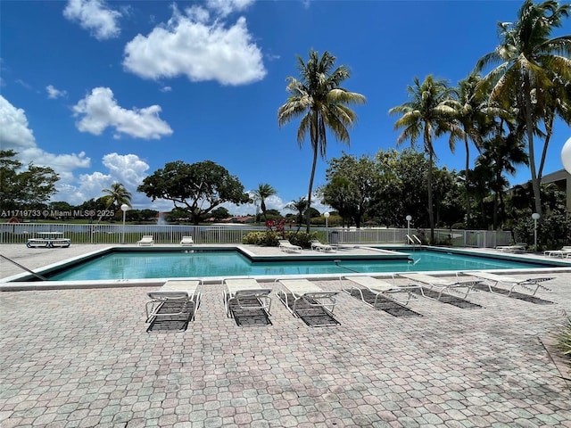 view of swimming pool featuring a patio area