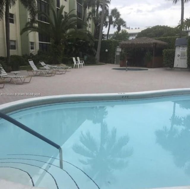 view of swimming pool featuring a patio area