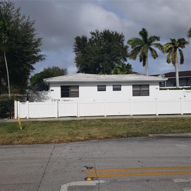 view of side of home featuring a yard