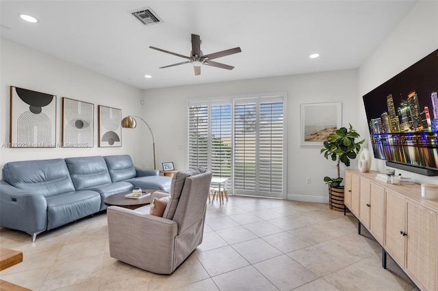 tiled living room with ceiling fan