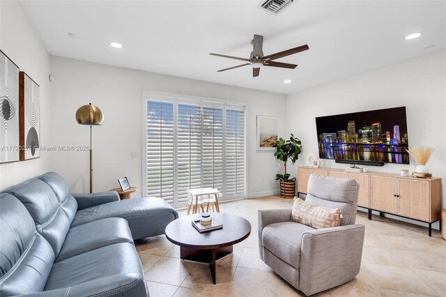 tiled living room featuring ceiling fan