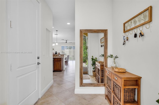 hall with light tile patterned flooring