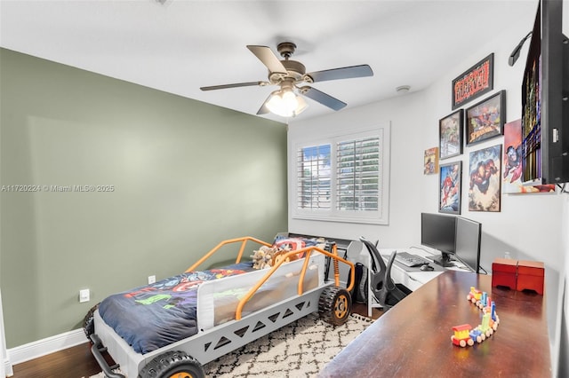 bedroom with hardwood / wood-style floors and ceiling fan