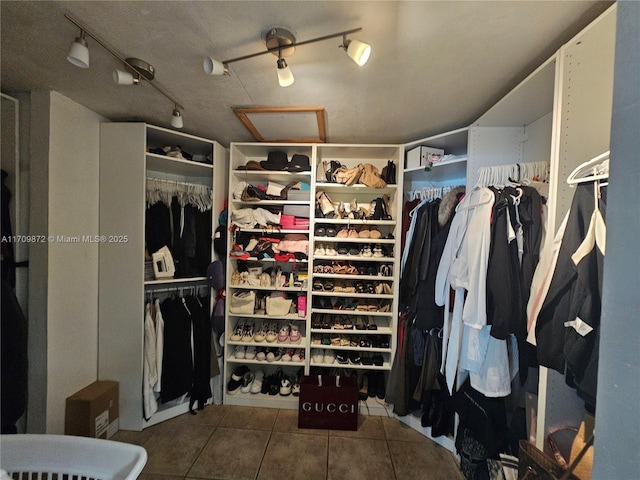 spacious closet with tile patterned flooring