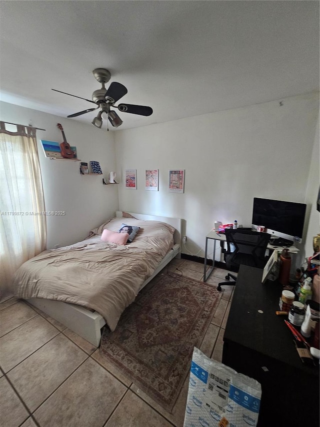 bedroom featuring ceiling fan and light tile patterned flooring