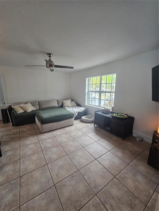14461 SW 152nd Ct, Miami, FL 33196 - unfurnished living room with baseboards, ceiling fan, and tile patterned flooring