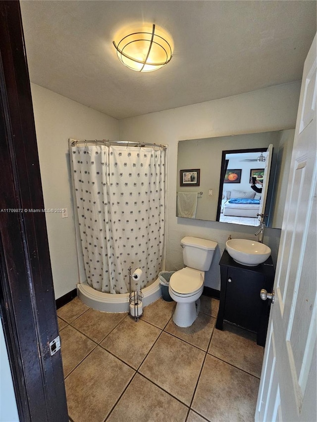 14461 SW 152nd Ct, Miami, FL 33196 - bathroom with tile patterned flooring, vanity, toilet, a shower with shower curtain, and baseboards