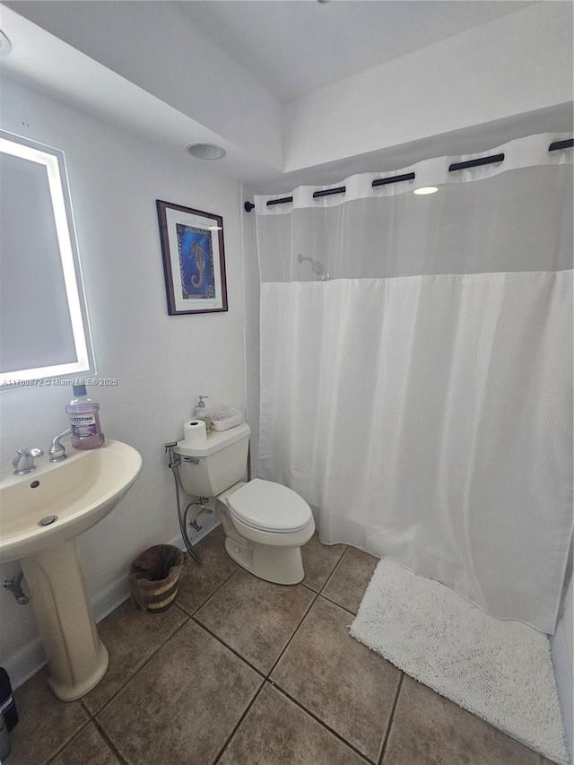 14461 SW 152nd Ct, Miami, FL 33196 - full bathroom with tile patterned flooring, toilet, and a shower with shower curtain