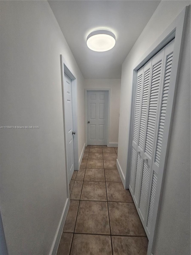 14461 SW 152nd Ct, Miami, FL 33196 - hallway featuring baseboards and tile patterned flooring