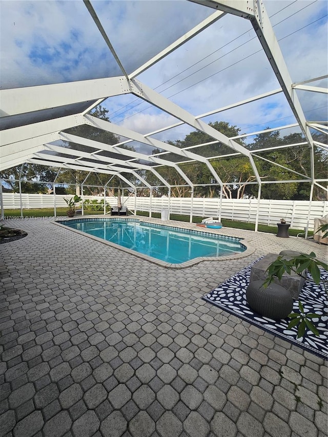 14461 SW 152nd Ct, Miami, FL 33196 - view of pool with a fenced backyard, a fenced in pool, glass enclosure, and a patio area