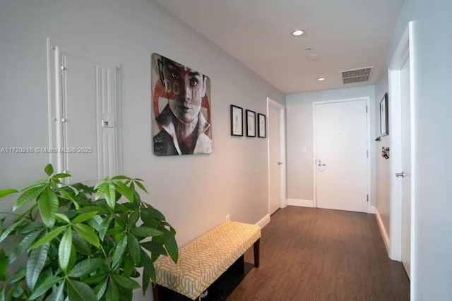 corridor with dark wood-type flooring