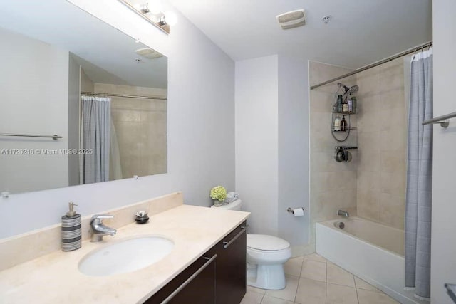 full bathroom with tile patterned floors, vanity, shower / tub combo, and toilet