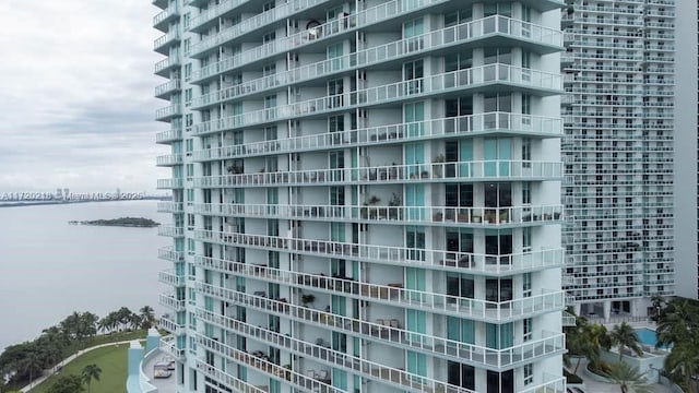 view of building exterior with a water view