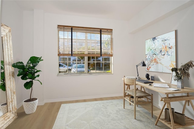 office space with light hardwood / wood-style flooring