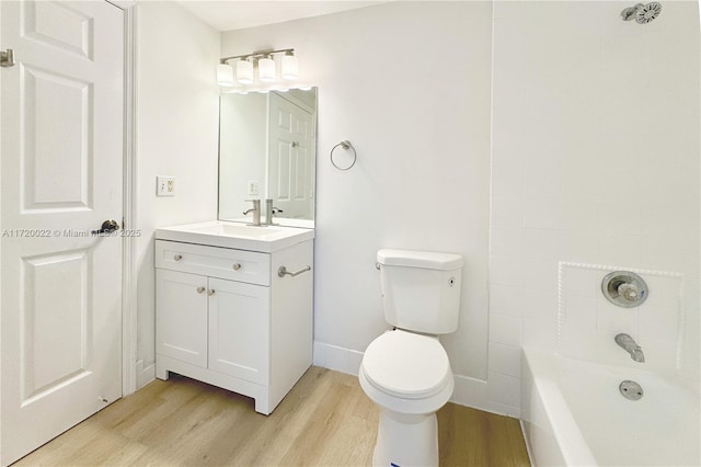 bathroom featuring hardwood / wood-style floors, toilet, and vanity