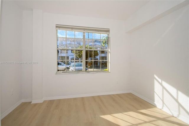 empty room with light hardwood / wood-style floors